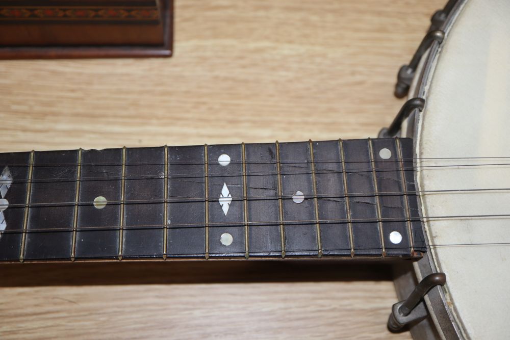 A six string banjo, length 94cm